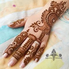 hendi tattoos on the palm of a woman's hand