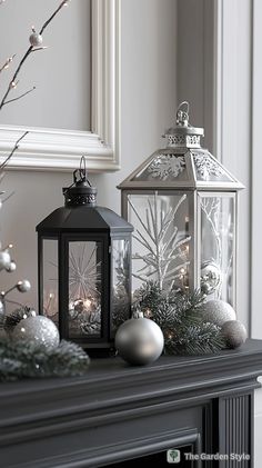 a mantle with two lanterns and ornaments on it