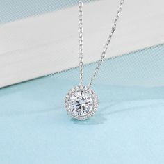 Product Information 
  


Metal: 
925 Sterling Silver 


SKU: 
MS-LSHD-031/ MS-LSHD-032


Rhodium: 
Yes 


Nickle Free: 
Yes 


Necklace Length:
18''


Gem Type: 
Moissanite


Stone Color: 
White


Stone Cut: 
Round Cut


Earrings Stone Weight:
1.0ct


Necklace Stone Weight:
1.0ct


Average Clarity: 
FL-IF 


Average Color: 
D-E 











LOOKS THE SAME AS DIAMOND (WITH NAKED EYES)
While diamonds are graded on the 4 C’s scale (Cut, Clarity, Color, Carat), AINUOSHI Moissanite® are not diamond, and are graded solely on color. The cut and clarity are similar across different qualities.

Moissanite have higher dispersion and refractive index, and the result is that the fire color is better than diamonds. One good moissanite is almost perfect. AINUOSHI Moissanite® will bring you the best expe Change Appearance, Colored Moissanite, Halo Jewelry, Solitaire Necklace, Halo Design, Moissanite Necklace, Halo Pendant, Moissanite Jewelry, Matching Necklaces