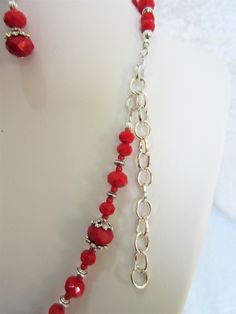 "Beaautiful handmade beads from Indonesia are blended with red opaque crystals and pewter accents to make this unique 20\" necklace. The lobster clasp is silver plated. A three inch extender is added. The earrings are red opaque crystals with silver plated ear wires. They dangle 3/4\" from the loop. This set will be wrapped in tissue and placed in an organza bag." Adjustable Red Beaded Necklace With Lobster Clasp, Red Czech Glass Jewelry With Spacer Beads, Nickel-free Red Czech Glass Jewelry, Red Beaded Czech Glass Jewelry, Red Czech Glass Jewelry With Faceted Beads, Red Beaded Dangle Necklaces, Irish Cross, Gold Sand, Crystal Jewelry Sets