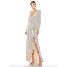 Mac Duggal Dress Size 4 Evening Gown Sequin Silver Cream New V Neck Long Sleeve Brand New With Tags. Retails $498 Long-Sleeved Sequin Faux Wrap Gown With A Flirty Ruffle Side Slit And Soft, Sweeping Train. Ieena For Mac Duggal Fully Lined Back Zipper Long Sleeve Full Length V-Neck Style #26395 Bust Seam To Seam 17 In Waist 28 In Beaded Dresses Can Be In Fantastic Condition And Still End Up With A Few Sequins And Beads Missing, Just As They Could In The Store. Item As Shown In Photos. Fast Ship - 1 Day Handling. Happy To Answer Questions You May Have. Mac Duggal Dress, Ruffled Gown, Sequin Evening Gowns, Mac Duggal Dresses, Long Sleeve Gown, Designer Prom Dresses, Prom Designs, Surplice Neckline, Long Sleeve Sequin