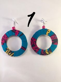 Large African handmade earrings made from African print material. Handmade Pink Circular Earrings, Handmade Pink Circle Earrings, Multicolor Wrap Earrings As Gift, Multicolor Hand Painted Earrings For Beach, Handmade Multicolor Wrap Earrings For Gift, Handmade Artsy Circle Earrings, Hoop Earrings Style, Large Earrings, Jewelry Earrings Hoops