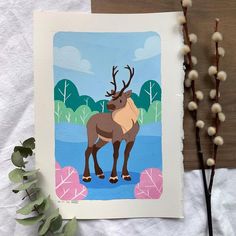 a card with an image of a deer on it and some plants next to it