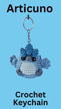 a crochet keychain with an image of a blue bird on it