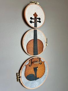 two pieces of art that have been made to look like violins on the wall