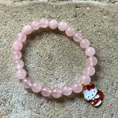 Beautiful 8mm Rose Quartz Beaded Bracelet With Hello Kitty Pendant. Will Fit Most Wrists (7 Inches). Hello Kitty Beaded Bracelet, Hello Kitty Bracelets, Random Accessories, Hello Kitty Bracelet, Rose Quartz Bracelet Beads, Pink Beaded Bracelets, Crystal Bead Jewelry, Rose Quartz Bracelet, Bracelets Diy