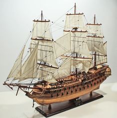 a wooden model of a sailing ship