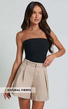 Update your summer wardrobe with our Sanvi Shorts in Stone. These high-waisted pleat tailored shorts are a must-have for any fashionista. Made from 100% cotton, they offer the perfect combination of comfort and style. The neutral stone color makes them versatile for any occasion - dress them up or down for a casual day out or a party night! The A-line silhouette flatters all body types, while the high waist design accentuates your curves. Pair these shorts with a crop top and sandals for an effortlessly chic look that will turn heads wherever you go. Don't miss out on adding these trendy shorts to your collection!Product Details:A-line style shortsMade from cotton fabricHigh waist designZips and pockets for convenienceInner lining for added comfortPerfect for party occasionsSize and FitSiz Neutral Stone, Beige Shorts, Tailored Shorts, Style Shorts, Trendy Shorts, Party Night, High Waisted Shorts, Summer Wardrobe, Occasion Dresses