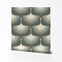 a green and white wallpaper with palm leaves on it's back side, in front of a white background