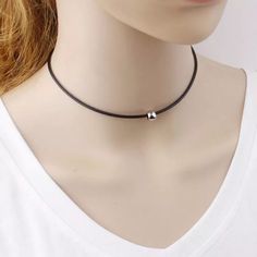 Classic black choker silver or gold ball charm simple chic everyday wear matches any outfit This product description features a classic black choker with a silver or gold ball charm, perfect for simple and chic everyday wear that effortlessly complements any outfit. Adjustable Dainty Black Choker, Adjustable Clavicle Chain Choker, Black Choker With Clavicle Chain, Trendy Clavicle Chain Choker For Everyday, Trendy Everyday Clavicle Chain Choker, Trendy Everyday Choker With Clavicle Chain, Simple Choker As Gift, Minimalist Black Choker As A Gift, Everyday Clavicle Chain Choker