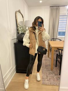 Crop Tops Winter Outfits, Outfits With Tan Vests For Women, Italy In The Winter Outfits, Fall Outfit With Vest, Puffer Vest Winter Outfit, Winter Casual Dinner Outfit, Winter Outfits With Vest, Mountain Trip Outfit Winter, How To Style Puffer Vest