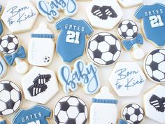 cookies decorated with blue and white icing are arranged in the shape of soccer gear