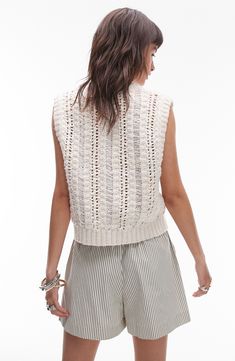 A mix of openwork stitches creates a breezy, vintage-chic aesthetic in this sleeveless sweater that buttons to just above the midriff. Button half placket Sleeveless 52% cotton, 34% polyester, 7% modal, 5% wool, 2% viscose Machine wash, dry flat Imported Chic Sleeveless Cable Knit Top, Sleeveless Cable Knit Vest For Spring, Spring Cable Knit Sleeveless Sweater Vest, Spring Sleeveless Cable Knit Sweater Vest, Trendy Spring Sweater Vest In Pointelle Knit, Chic Pointelle Knit Sweater Vest, Chic Pointelle Knit Sleeveless Sweater Vest, Trendy Open Knit Sweater Vest For Spring, Sleeveless Cable Knit Top