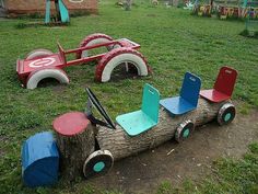 children's playground equipment in the shape of a log with wheels and seats on it