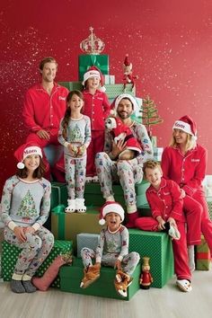 a group of people in matching christmas pajamas