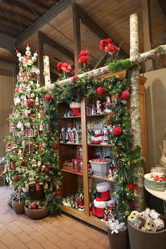 a christmas display in a store filled with lots of holiday decorations