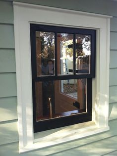 an open window on the side of a house