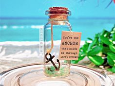 an anchor in a bottle with a note attached to it