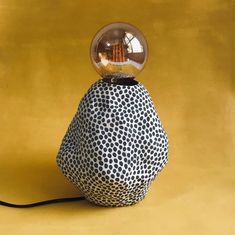 • The polka dotted ceramic t... Polka Dot Decor, Monochrome Decor, Lamp Inspiration, Ceramic Lamp Base, Pottery Lamp, Ceramic Light, Ceramic Table Lamp, Handmade Lighting, Lamp Socket