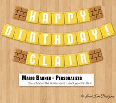 the words happy birthday are spelled in yellow letters on a wooden background with brick blocks