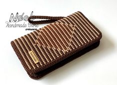 Elevate your style with this 20cm clutch, a stunning accessory designed to make a statement. Crafted with precision, this elegant piece features bold brown stripes arranged in a striking square pattern, creating a visually captivating contrast. The sleek design not only exudes sophistication but also provides a modern edge, perfect for any occasion. Its compact size makes it an ideal choice for carrying your essentials while maintaining a polished, refined look. Whether you're heading to a formal event or a night out, this clutch is sure to add a touch of contemporary glamour to your ensemble. All products are made to order. When you place your order, we make that item just for you, one at a time, for the best quality. Please allow 7-15 business days for your product to be made and to be s Vietnam Ho Chi Minh, Square Pattern, Black Square, Ho Chi Minh, Clutch Handbag, Formal Event, Evening Bags, Purses And Handbags, Sleek Design