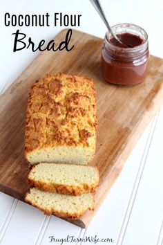 a loaf of coconut flour bread sitting on top of a cutting board