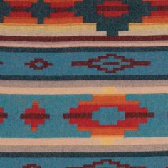 an old navajo rug with different colors and designs