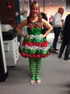 a woman dressed up like a christmas tree