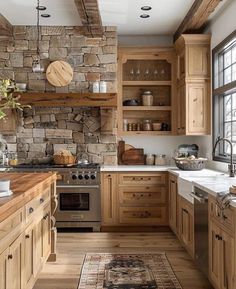 a kitchen with wooden cabinets and stone walls