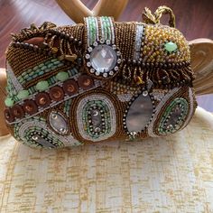 Stunning Brown Multi Colored Beaded Bag New With Tags. Two Compartments Inside With A Third Zippered One. Gorgeous Braided Handle. This Is A Real Eye Catcher. Bohemian Hand Embellished Party Bags, Bohemian Embellished Evening Bag For Parties, Bohemian Embellished Party Evening Bag, Bohemian Embellished Bags For Formal Occasions, Bohemian Embellished Party Bags, Bohemian Embellished Formal Bags, Bohemian Embellished Party Shoulder Bag, Bohemian Embellished Rectangular Evening Bag, Bohemian Embellished Pouch Evening Bag