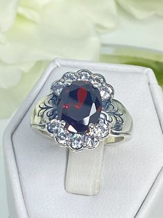 Garnet CZ Ring Fine Jewelry Oval Cubic Zirconia Crystal Ring, Dazzling Oval Cubic Zirconia Crystal Ring, Classic Oval Crystal Ring With Accent Stones, Oval Cubic Zirconia Crystal Ring For Formal Occasions, Oval Cubic Zirconia Ring For Formal Occasions, Elegant Silver Cluster Ring With Birthstone, Formal Oval Cubic Zirconia Rings, Silver Oval Cluster Ring For Gift, Dazzling Oval Crystal Ring For Anniversary