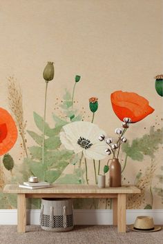 an orange and green floral wallpaper in a living room with a wooden coffee table