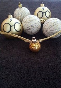 harry potter christmas ornament with glasses and gold baubles on black carpet