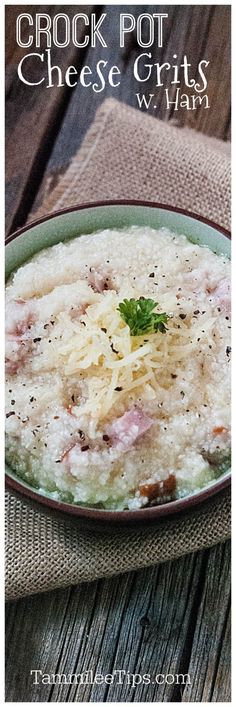 a bowl of cheese grits on top of a wooden table