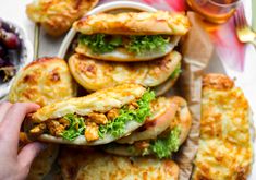 there is a plate full of food that includes breads and other foods on the table