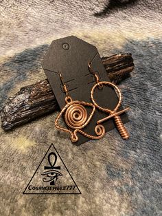 Ankh & EyE of Horus This pair of earrings was designed using copper wire. Ankh Wire Jewelry, Handmade Ankh Shaped Metal Jewelry, Bronze Ankh Shaped Metal Jewelry, Copper Wire Ankh, Symbolic Ankh-shaped Metal Jewelry, Augusta Ga, Eye Of Horus, Earring Tutorial, Copper Earrings