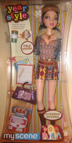 the doll is in its box and has many items on it's display stand