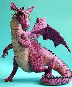 a pink dragon figurine on a blue background