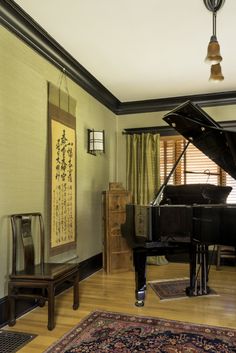 The tansu behind the piano was used to hold shoes in a Japanese entry. The Qing Dynasty-style chair may date from the 1950s; the scroll tells the origins story of sun goddess Ameterasu. 1920 Bungalow, Style Piano, A Perfect Marriage, Asian Aesthetic, Sun Goddess, Piano Room, Arts And Crafts House, Perfect Marriage