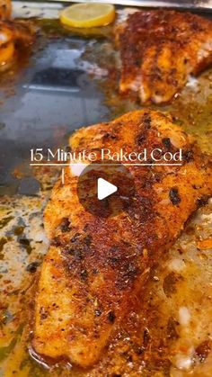 some chicken is cooking in a pan with lemons and spices on the stove top