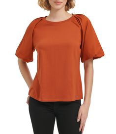 From Calvin Klein&#x2C; this blouse features:  crew neckline short puff sleeves pullover construction approx. 24" length cotton/modal hand wash Imported. Solid Color Cotton Puff Sleeve Top With Crew Neck, Solid Cotton Puff Sleeve Top With Crew Neck, Calvin Klein Cotton Short Sleeve Tops, Calvin Klein Short Sleeve Spring Top, Fall Cotton Puff Sleeve Top With Short Sleeves, Cotton Puff Sleeve Top With Short Sleeves For Fall, Calvin Klein Short Sleeve Top For Spring, Cotton Puff Sleeve Top For Fall, Calvin Klein Spring Short Sleeve Top