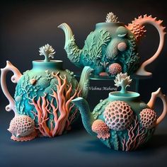 three teapots with sea creatures on them are sitting side - by - side