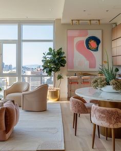 a living room filled with lots of furniture and large windows overlooking the cityscape