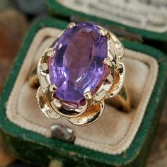 This vintage buttercup style ring features an oval step cut amethyst in a six prong setting. It is crafted in 14k yellow gold and currently a size 7.5. Amethyst Vintage Ring, Extravagant Dresses, Buttercup Ring, Antique Cocktail Ring, Amethyst Rings, Unique Rings Vintage, Vintage Cameo, Step Cut, Prince Charming