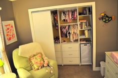 a baby's room with a chair, dresser and closet in the corner is shown