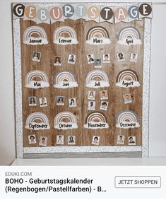 a bulletin board with pictures and rainbows in german language on the wall above it