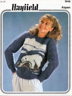 a woman wearing a sweater with an image of a dog on it in the middle