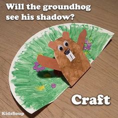 a paper plate with a bear on it that says, will the groundhog see his shadow? craft