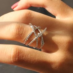 KNOT CRISSCROSS RING ✨💎 May this ring... Find your special someone in a complex and intersecting path. ✨ 🚩 DOUBLE SHINING! �🚩 DOUBLE SPARKLING! 🚩 DOUBLE VALUE! * Heavy Rhodium plating over Sterling Silver * Top Grade 5A Cubic Zirconia Diamond Alternatives 👍 Recommendations * As an everyday ring * As a travel wedding band ✈ * As an anniversary ring for couples 🎁 💎 Features Inspired by a vine knot, a Crisscross ring in a modern way. * FACE HEIGHT: 17mm (0.7 inches) * SKU: SMYC0025R ⭐ ⭐ ⭐ ⭐ ⭐ Crisscross Ring, Ring Redesign, Criss Cross Ring, Silver Top, Zierlicher Ring, Everyday Ring, Diamond Alternatives, Writing Gifts, Estilo Hip Hop