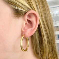 These stunning polished 14k yellow gold hoops provide a look that is both trendy and classic. While they were once worn by kings and queens to signify power and social status, hoop earrings are now considered a statement of unity and strength. Hoop earrings stand out, just like the strong people who sport them. These earrings are a great staple to add to your collection, and can be worn with both casual and formal wear. These hoop earrings would make the perfect gift for your loved one of yourse Earrings Stand, Kings And Queens, Social Status, Earring Stand, Gold Hoops, Gold Hoop, Gold Hoop Earrings, Hoop Earrings, Yellow Gold